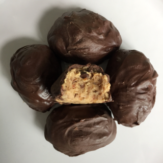 Looking for edible protein cookie dough? Try this five ingredient protein paleo cookie dough - 5 minutes to make, no bake, egg-free, and vegan protein balls with NO refined sugar! This creamy, smooth, and deliciously rich recipe is filled with protein and is paleo, low carb, vegan, paleo, gluten free, dairy free, and sugar free, and so festive for Easter! Check it out now! #glutenfree #vegan #healthy #lowcarb #cookiedough #paleo